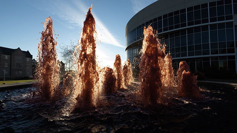 Five-foot columns of water jet upward from the fountain in front of the Juanita K. Hammons Hall for the Performing Arts.