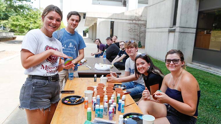 Students in the Stem LLC doing crafts and games during a Welcome Weekend social event.