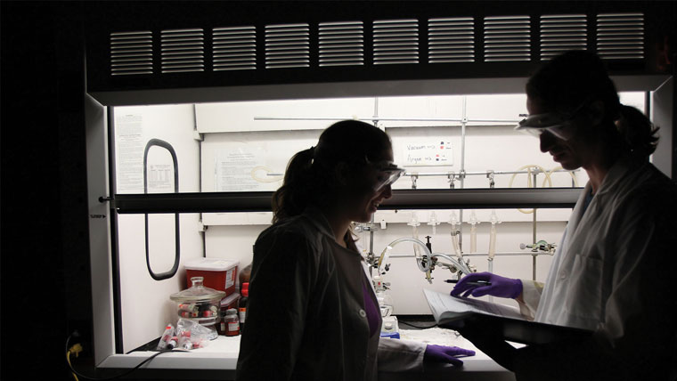 Two students conducting an experiment.